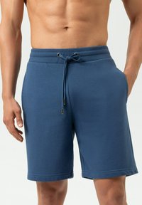Blauwe katoenen shorts met een geribbelde tailleband, trekkoordsluiting en zijzakken. Gladde textuur en knie-lengte ontwerp.