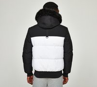 Black and white puffer jacket with a fur-lined hood, featuring a horizontal color block design, elastic cuffs, and a rear hanging loop.
