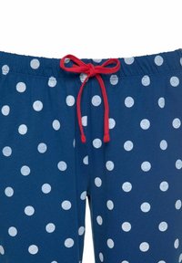 Dunkelblaue Schlafanzughose mit weißen Punkten, elastischem Bund und rotem Kordelzug. Weiches, dehnbares Material mit lässigem Design.