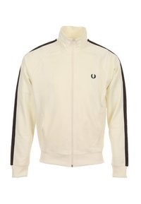 Beige jas met rits en hoge kraag, met donkerbruine strepen aan de zijkant en een klein geborduurd logo op de borst. Zachte stof, atletische pasvorm.