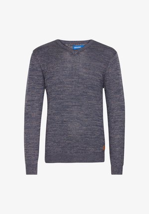 Tume sinine kudumine sviiter pikkade varrukatega ja V-kaelusega. Omab soonikuga mansette ja allserva, väikese pruuni naha logotagi allosas.