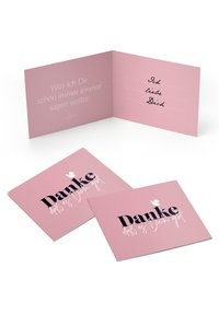 Rozā apsveikuma kartīte ar melnbaltu "Danke" dizainu; iekšpusē ir līnijotas daļas un vācu teksts "Was ich Dir sagen wollte."