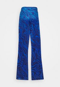Pantalon évasé à imprimé zèbre bleu et bleu foncé avec une taille haute et un texte subtil "Juicy Couture" intégré dans le motif.
