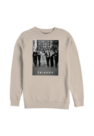 Sweat-shirt beige avec une photo en noir et blanc de six personnes marchant bras dessus bras dessous dans une rue de la ville, avec le mot « AMIS » sous la photo.