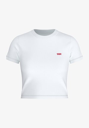 T-shirt court blanc en coton, avec des manches courtes et un col rond. La poitrine arbore un petit patch du logo rouge Levi's.