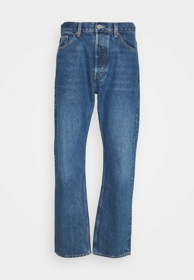 Blauwe denim jeans met een rechte pijp, vijf zakken en een knoopsluiting. Kenmerkt zich door minimale vervaging en contrasterende stiksels.