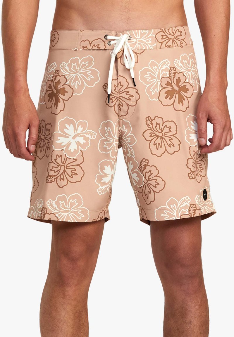 Herrbordshorts i ljusbrun färg med vita och bruna blommönster. Har en dragsko och en märkespatch på sidan.