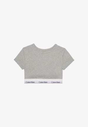 Kurzes graues Crop-Top mit kurzen Ärmeln und einem weißen unteren Saum mit wiederholtem "Calvin Klein"-Textlogo.