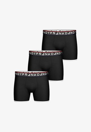 Mustat boxerit kolmessa paketissa, joissa on valkoinen ja punainen joustovyö, jossa on brändin nimi "FRANK DANDY" ja valkoinen reuna.