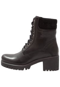 Bottine en cuir noir avec un talon épais robuste, fermeture à lacets sur le devant et un accent en daim au niveau du col. Semelle en caoutchouc crantée pour une meilleure adhérence.