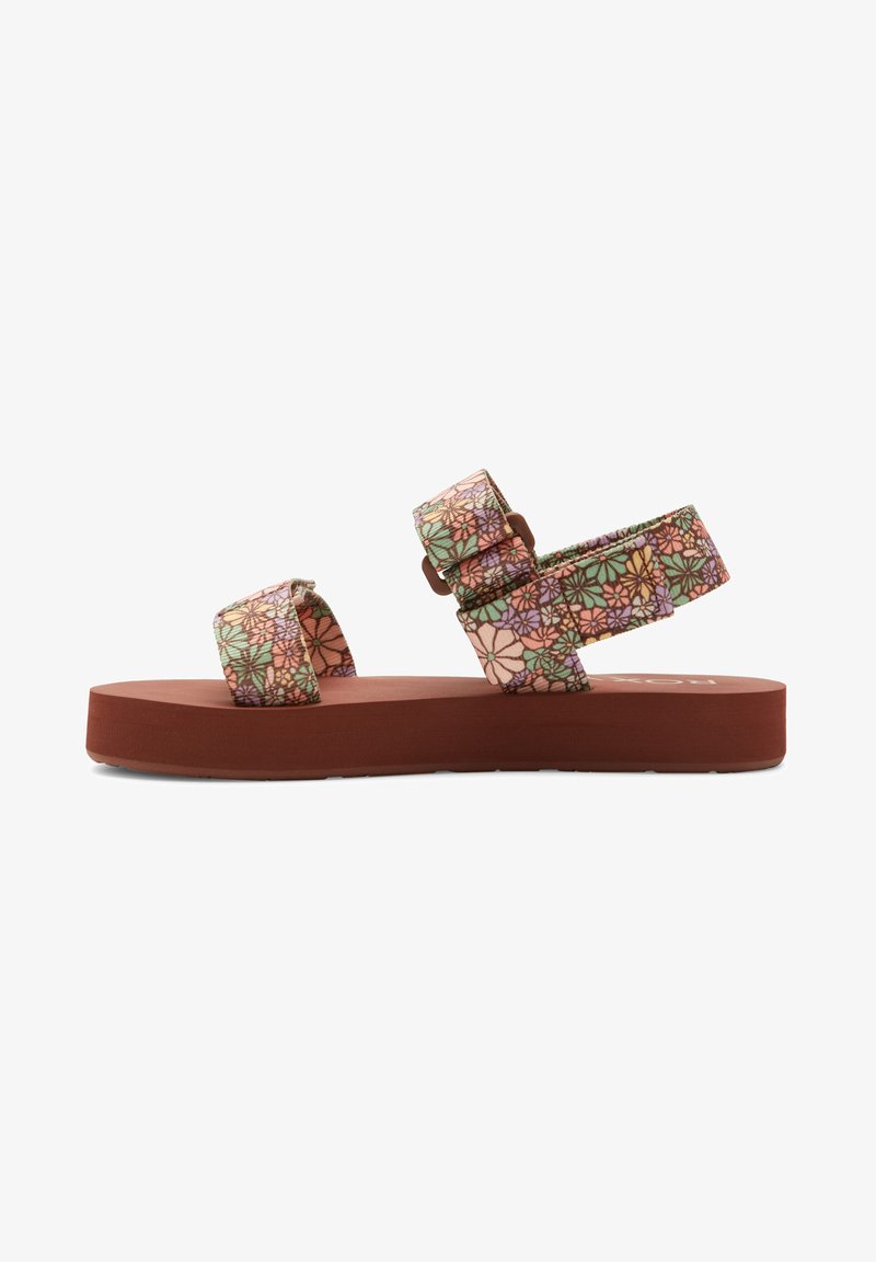 Blomstrete stoffsandaler med to justerbare stropper i grønt, rosa og lilla, hviler på en solid brun gummisåle. Kraftig plattformdesign.