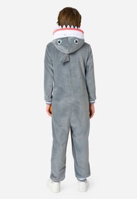 Grijze haai-thema romper met een capuchon met ogen, tanden en een rugvin. Gemaakt van zachte fleece, met ribgebreide boorden en details op de capuchon.