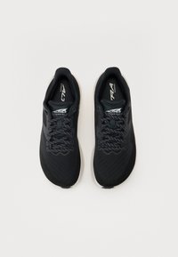 Black running shoes with a mesh upper, flat laces, and a white outsole. Features a textured pattern on the upper and a logo on the tongue.