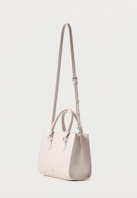 Structured handbag in light beige synthetic material. Features dual short handles and a long adjustable strap. Clean lines and minimal detailing.