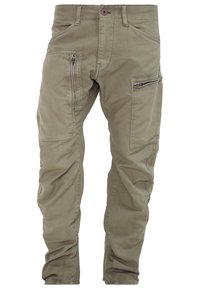Khaki cargo broek gemaakt van een katoenmix. Bevat meerdere ritszakken en heeft een ontspannen pasvorm. Gestikte naden en een taps toelopend beenontwerp.