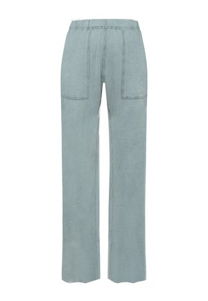 Hellblaue, weit geschnittene Hosen mit einer strukturierten Stoffqualität, elastischem Taillenbund und zwei Fronttaschen. Die Nähte sind in einer kontrastierenden Farbe gehalten.