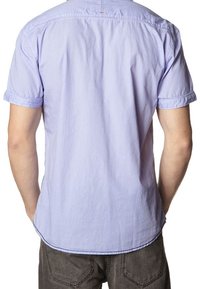 Light blue short-sleeve shirt with a smooth texture, rounded hem, and rolled sleeves. Simple design with no visible patterns or hardware.