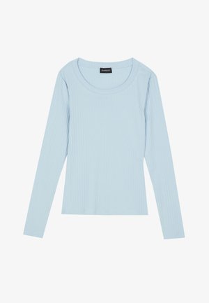 Light blue long-sleeve ribbed top with a round neckline and fitted design. Soft texture with a subtle pattern running vertically.