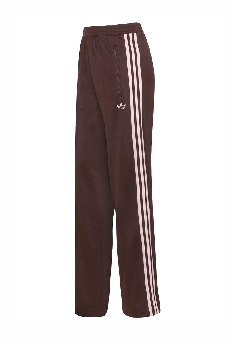 Brown athletic pants made of soft fabric, featuring three vertical light pink stripes on the sides and a small logo near the hip.