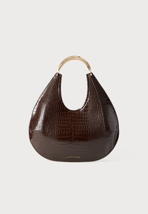 Brown crocodile-embossed leather bag with a curved silhouette, gold-tone metal handle, and smooth texture. Features a visible brand logo.