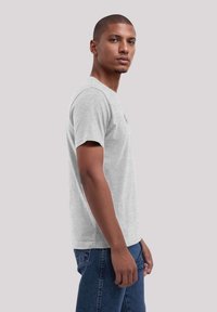 Gray short-sleeve t-shirt with a standard fit, made from soft cotton, featuring a crew neck and no visible patterns or accents.