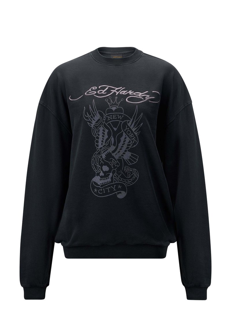 Czarna bluza z bawełny, z dużą grafiką na przedzie przedstawiającą orła, czaszkę i tekst. Żeberkowe mankiety i dekolt. Luźny krój.