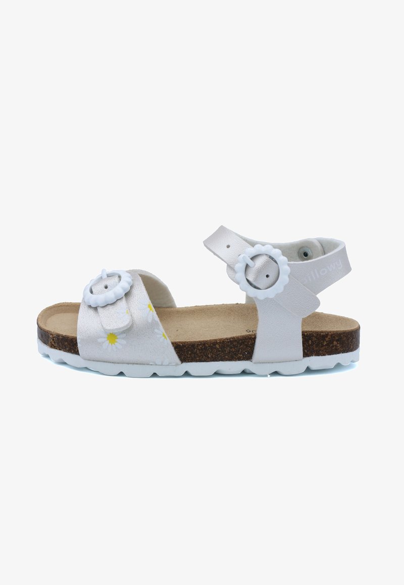 Sandale blanche ornée de motifs floraux, dotée de deux boucles réglables, d'une semelle en liège et d'une semelle extérieure blanche. Conçue pour le confort et la durabilité.