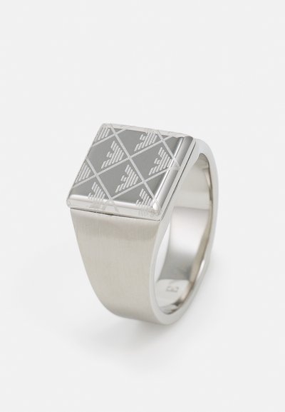 Silver ring with a square top featuring a geometric engraved pattern. Smooth band with a brushed finish.
