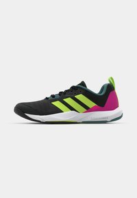 Black athletic shoe with green and pink accents, featuring a textured upper, lace closure, and a white sole with "Lichtstrine" branding.