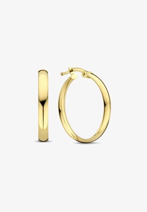 Goldene Creolen mit einer glatten, polierten Oberfläche. Verfügen über einen traditionellen Verschluss und eine runde Form. Einheitliche Dicke über die gesamte Länge.