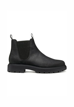 Botas Chelsea de cuero negro con paneles laterales elásticos, tiradores y suelas de goma resistentes. Textura suave, diseño de altura hasta el tobillo.