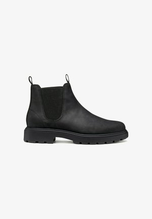 Bottines Chelsea en cuir noir avec des panneaux élastiques sur les côtés, des tirants et des semelles en caoutchouc robustes. Texture lisse, design hauteur cheville.