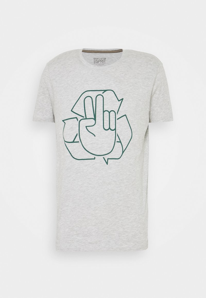 T-shirt en coton gris clair avec un graphisme vert foncé représentant une main faisant le signe de la paix à l'intérieur d'un symbole de recyclage.