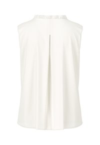 White sleeveless top with a ruffled neckline, featuring a back pleat design, soft fabric texture, and smooth silhouette.