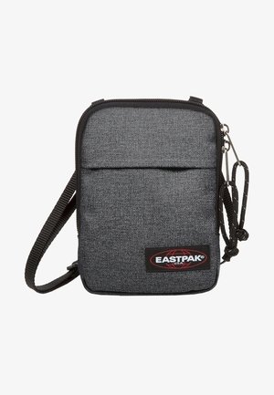 Mała prostokątna szara torba na ramię z tkaniny z czarnym obszyciem, przednią kieszenią, regulowanym paskiem i naszywką z logo Eastpak.