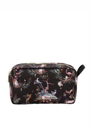 Black cosmetic bag with floral and animal print, featuring green and pink accents. Gold zipper and logo detail on the front. Textured fabric.