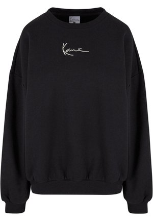 Black sweatshirt featuring a crew neck, ribbed cuffs, drop shoulders, and embroidered white logo on the chest. Soft fabric with a relaxed fit.