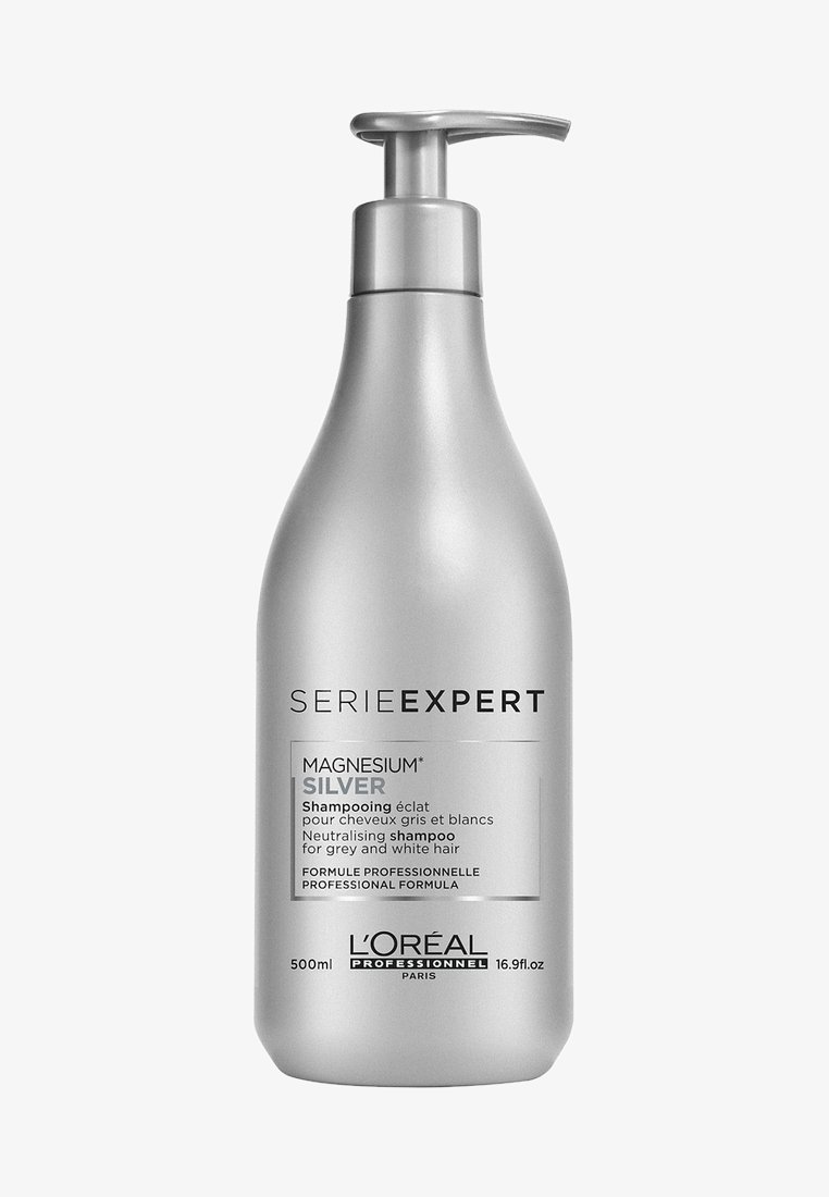 Zilveren plastic fles met pompdispenser, gelabeld "Serie Expert Magnesium Silver," 500 ml, ontworpen voor de verzorging van grijs en wit haar.