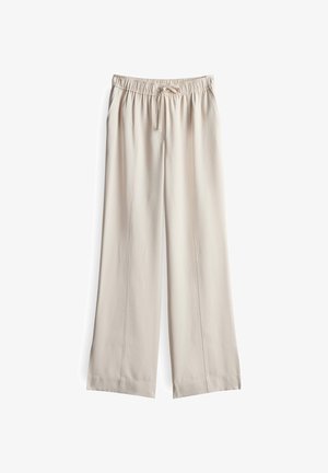 Beige, wijde broek van lichtgewicht stof met een elastische tailleband en trekkoord, voorzien van verticale naden aan de voorkant.