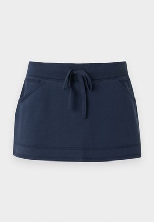 Μίνι φούστα σε ναυτικό μπλε με ελαστική μέση, κορδόνι στο μπροστινό μέρος και μπροστινές τσέπες, κατασκευασμένη από απαλό πλεκτό ύφασμα.