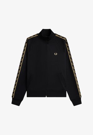 Chaqueta deportiva negra con cremallera, con logo de corona de laurel dorada en el pecho y franjas con patrón de corona dorada a juego en las mangas.