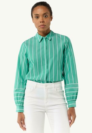 Green striped button-up shirt with long sleeves, featuring a collar, white stripes, and elastic cuffs, paired with white pants.