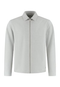 Lysegrå genser med glidelås, krage, lange ermer og subtilt teksturert stoff. Har glidelåslukking foran og en logo ved kanten.