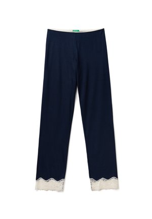 Pantaloni in maglia blu navy con vita aderente e bordo in pizzo bianco scallopato all'orlo, che offrono una texture liscia e una vestibilità rilassata.