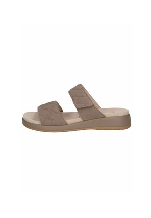 Brūni likti slaidu sandales ar divām regulējamām siksnām, mīkstu bēšas krāsas iekšpusi un gaismas krāsas gumijas ārējo zoli. Vienkāršs, mūsdienīgs dizains.
