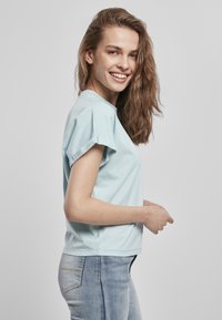 Urban Classics LADIES SHORT PIGMENT DYE CUT ON SLEEVE TEE - T-Shirt basic - seablue