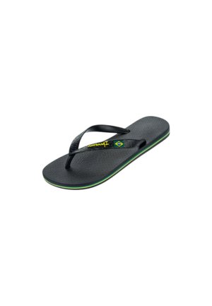 Infradito in gomma nera con suola strutturata, striscia verde e gialla lungo il bordo e cinturino con piccola bandiera brasiliana e marchio giallo.
