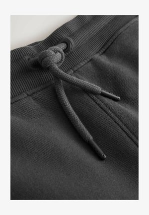 Hall halli dressipluus kangas soonilise vöökohaga. Varustatud punutud paelaga ja musta plastikust otsikutega reguleerimiseks.