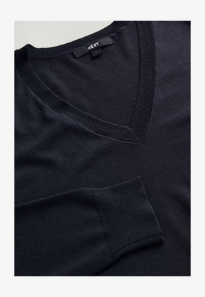 Dark navy V-neck sweater with a smooth texture, ribbed neckline, and a chest pocket on the left side. Made of lightweight fabric.