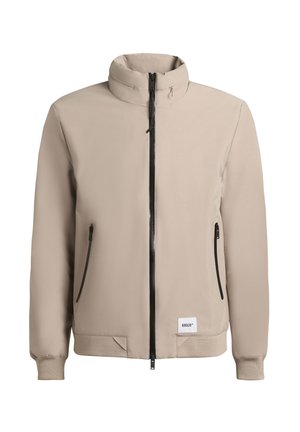 Beige lichtgewicht jack met een hoge kraag, centrale zwarte ritssluiting, twee zijzakken en elastische manchetten. Soepele textuur, minimalistisch ontwerp.